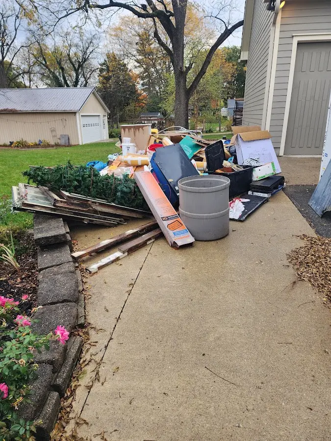 Dumpster being loaded with debris for Residential Dumpster Rental in Crystal River